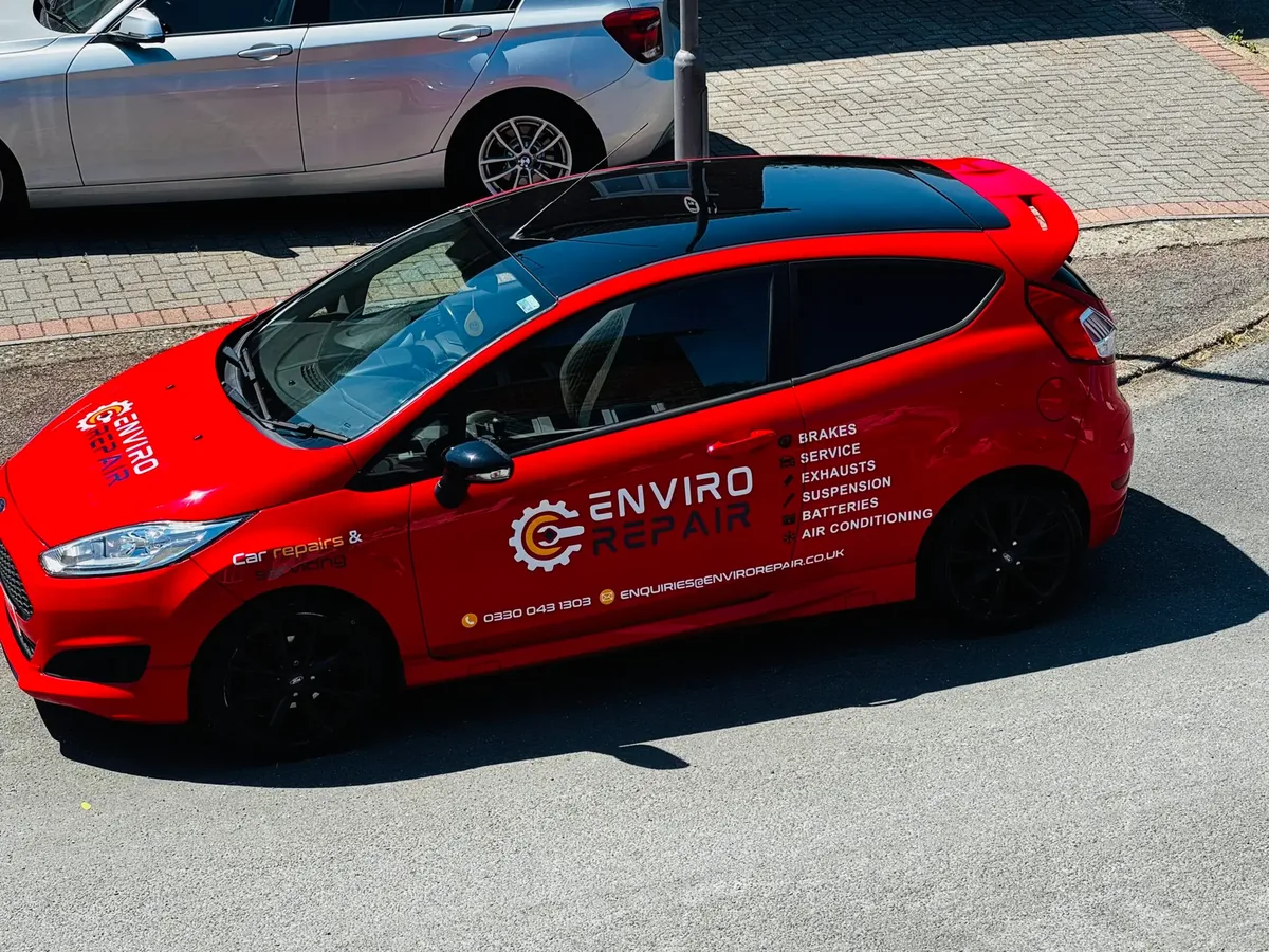 Enviro Repair branded car used for vehicle collection and delivery