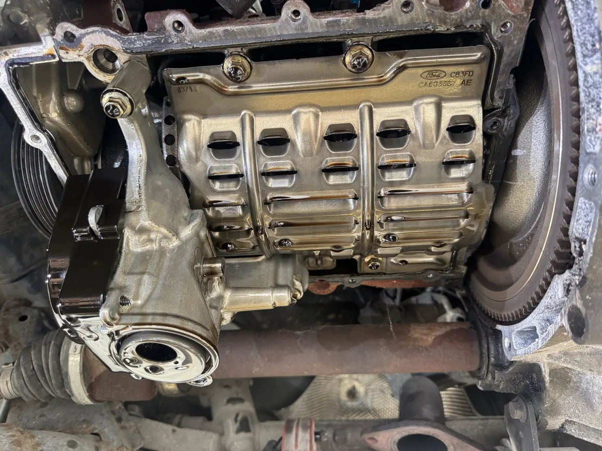 Ford EcoBoost with the sump removed, showing the oil baffle and pump