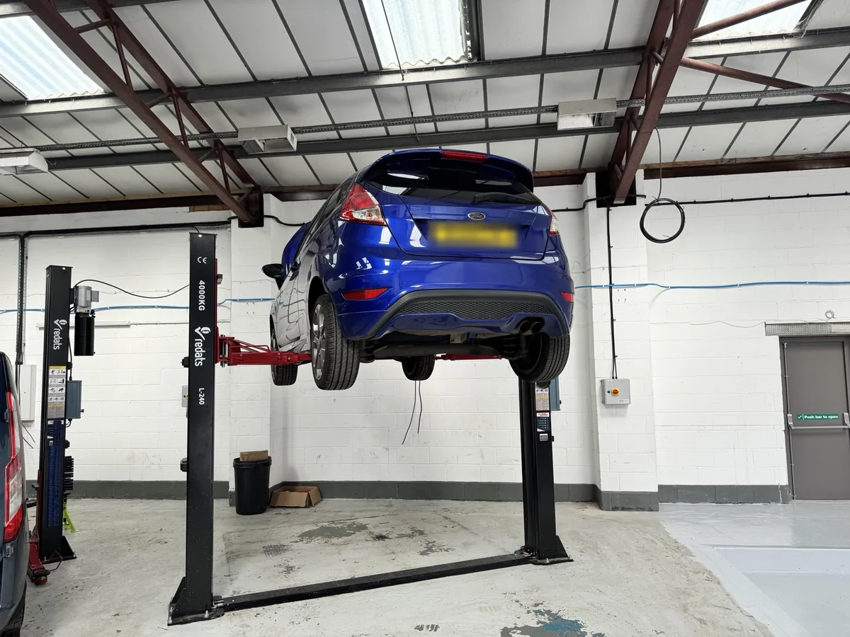 Ford Fiesta ST raised on a two-post lift at Enviro Repair's Royston workshop