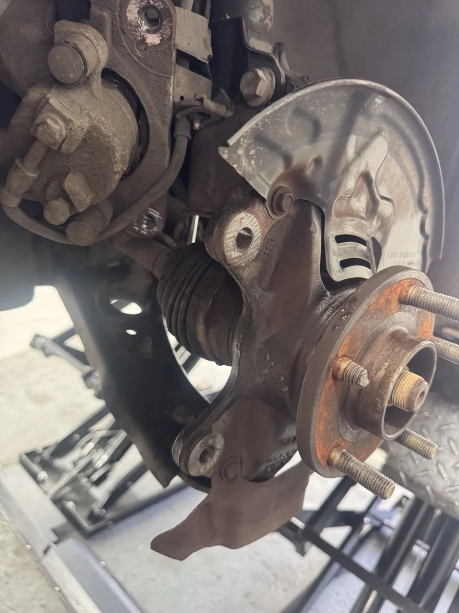 Front hub knuckle and brake disc during a wheel bearing job