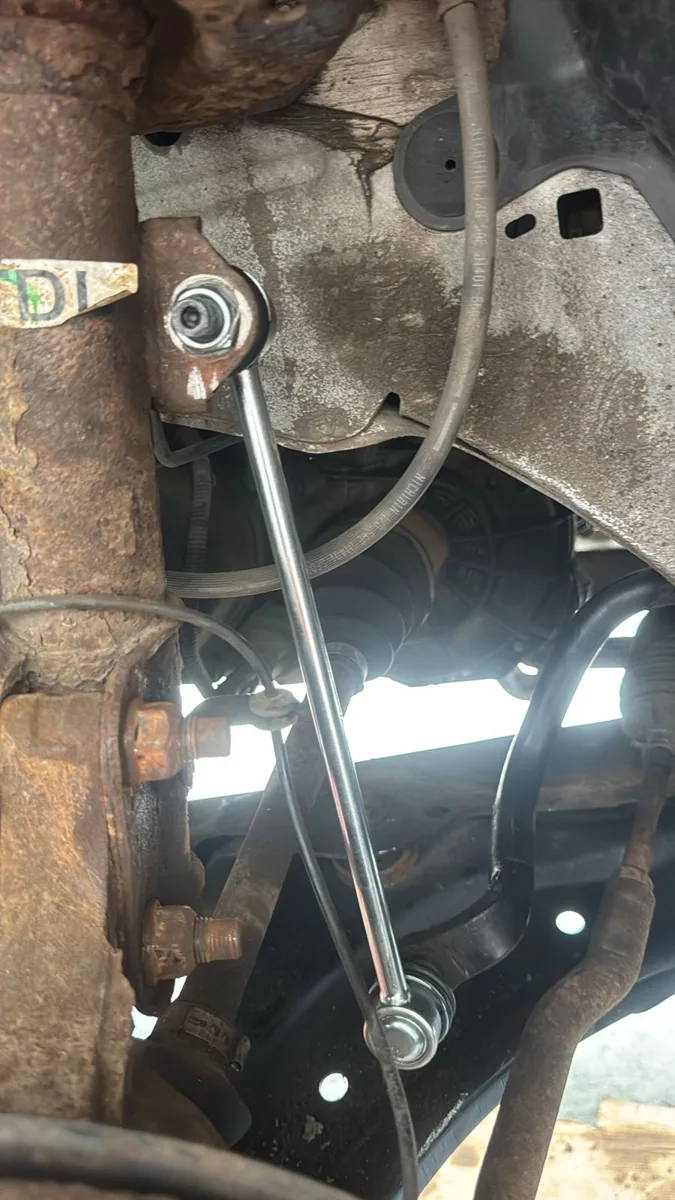 New anti-roll bar drop link fitted to a car