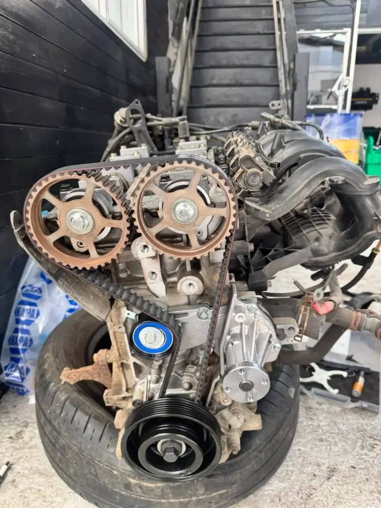 Replacement engine with a new timing belt and water pump fitted