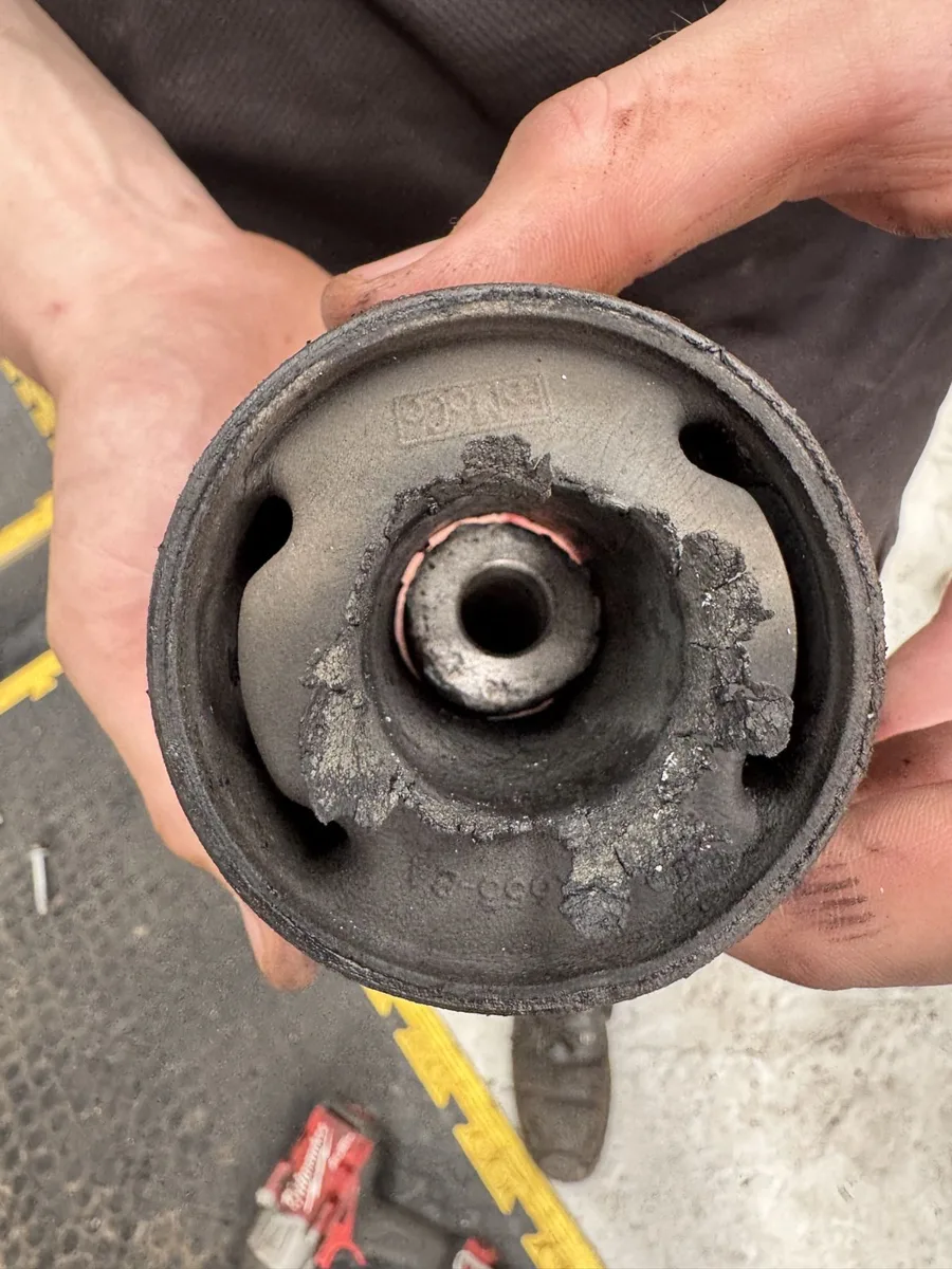 Perished suspension bush held in a hand