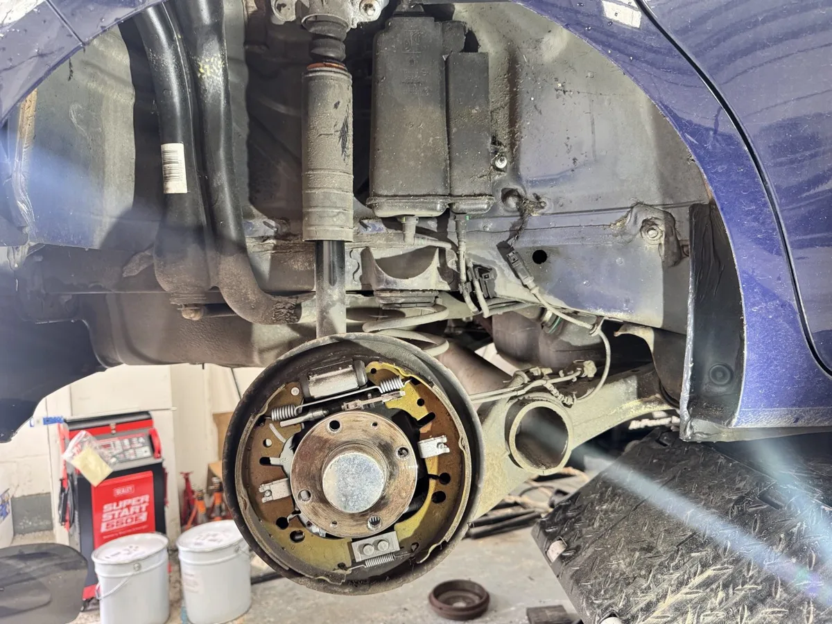 Rear brake shoes on the backplate with the drum removed