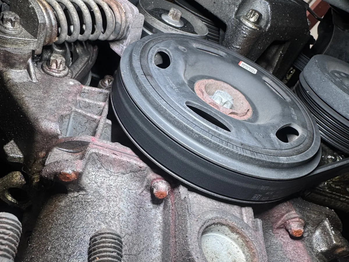 Pink coolant residue on the engine block of a Vauxhall Corsa with a coolant leak at our Royston workshop